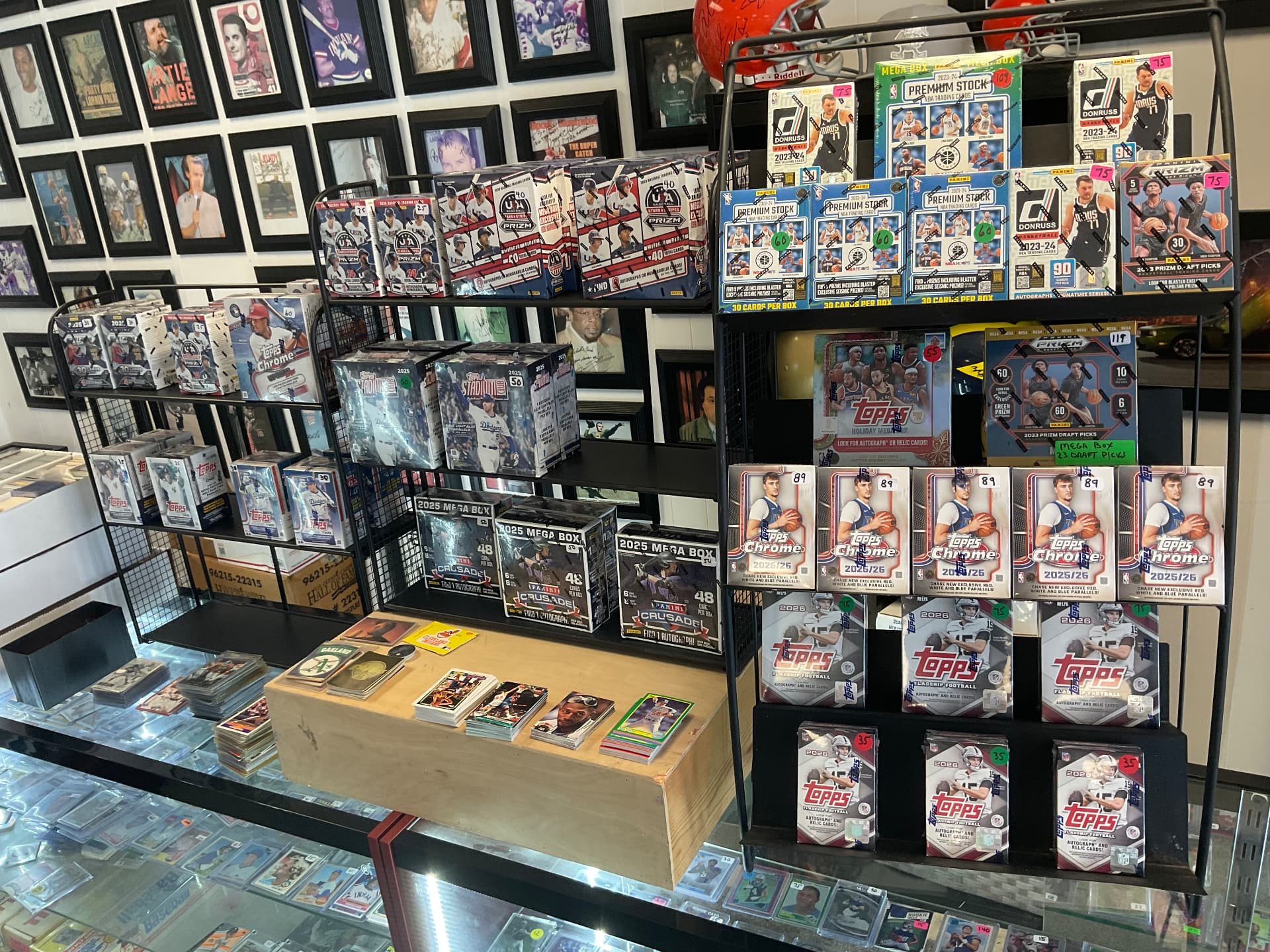 Racks of sealed blaster and mega boxes on the shop counter